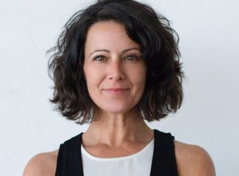 cheerful-middle-aged-woman-with-curly-hair-scaled-e1648922093675